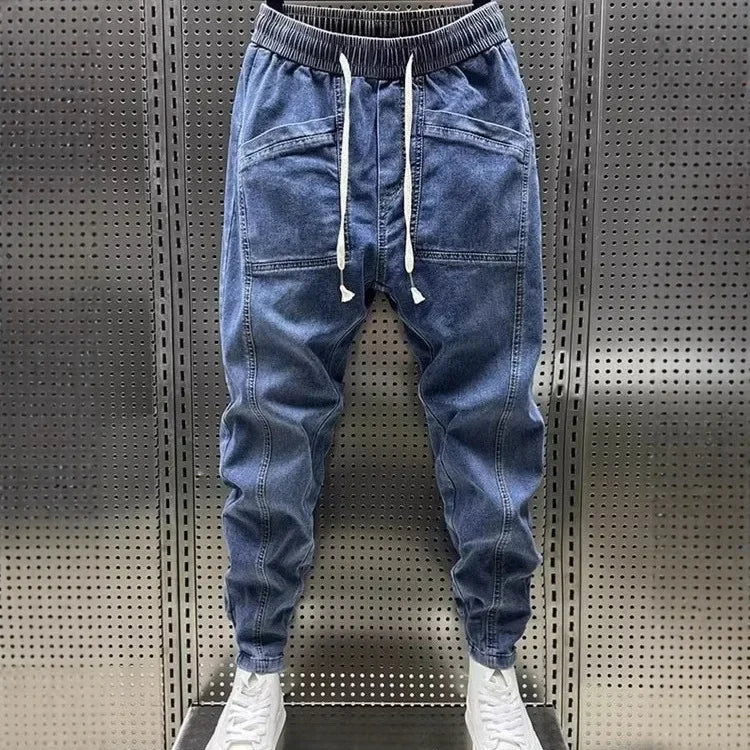 Pantalones vaqueros holgados de talla grande para hombre, informales, de moda, para otoño e invierno, con puños, estilo coreano, versátiles, duraderos, cómodos y ajustados.