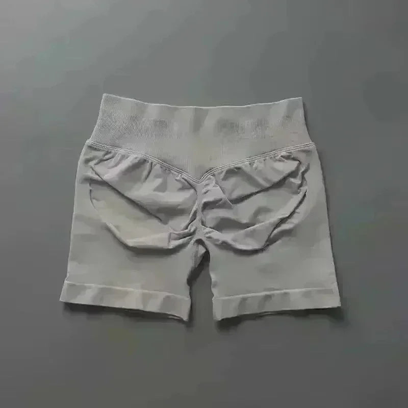 Pantalones cortos deportivos de yoga para mujer, de verano, con efecto piel de melocotón, con bolsillo en la cadera, cintura alta, levantamiento de cadera, secado rápido.