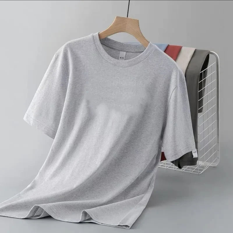 Camiseta de manga corta de color liso para hombre, corte entallado, clásica, versátil, interior, adelgazante, para verano, 2024
