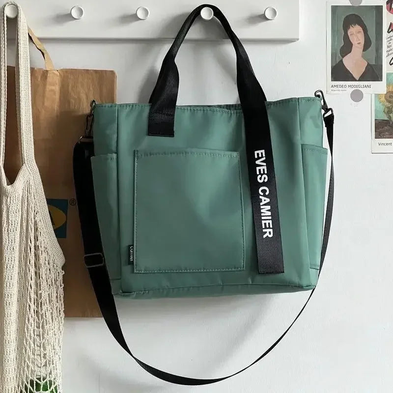 Nuevo bolso de hombro informal de gran capacidad, de nailon, impermeable, de lona, sencillo y moderno, para colegiala.