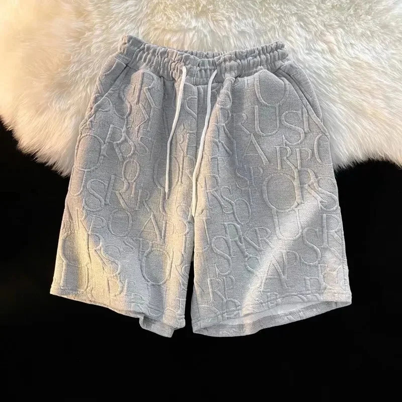 Pantalones cortos holgados de cinco puntos para hombre, estilo americano, estilo retro, de baloncesto, informales, de verano, con diseño de nicho y sensación de ocio.