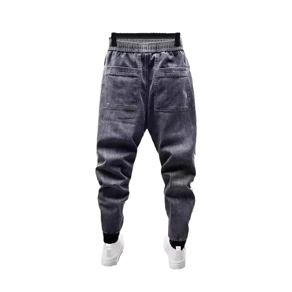 Pantalones vaqueros holgados de talla grande para hombre, informales, de moda, para otoño e invierno, con puños, estilo coreano, versátiles, duraderos, cómodos y ajustados.