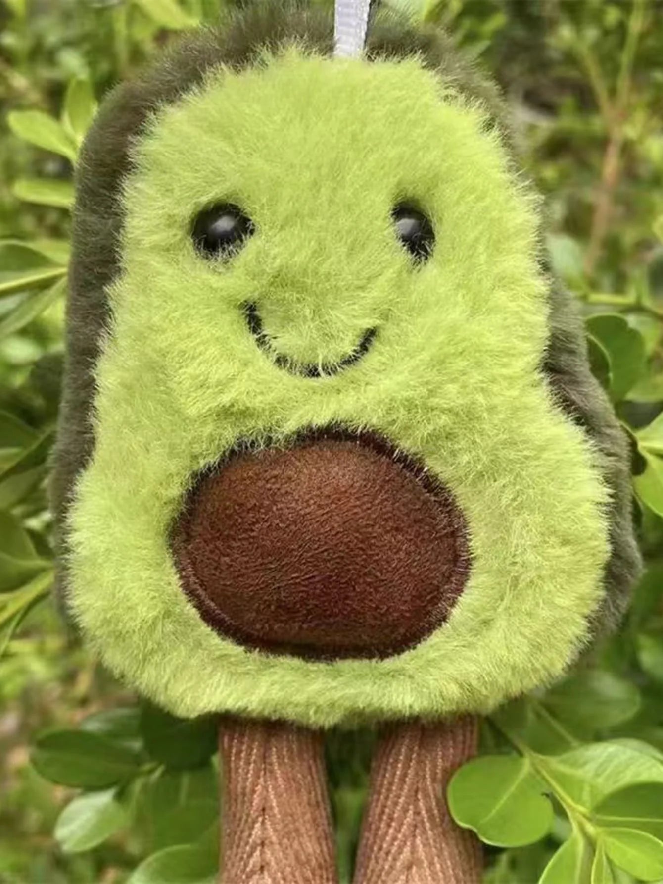 Un lindo juguete de peluche de aguacate para mascotas, adecuado para la compañía diaria de perros pequeños y medianos.