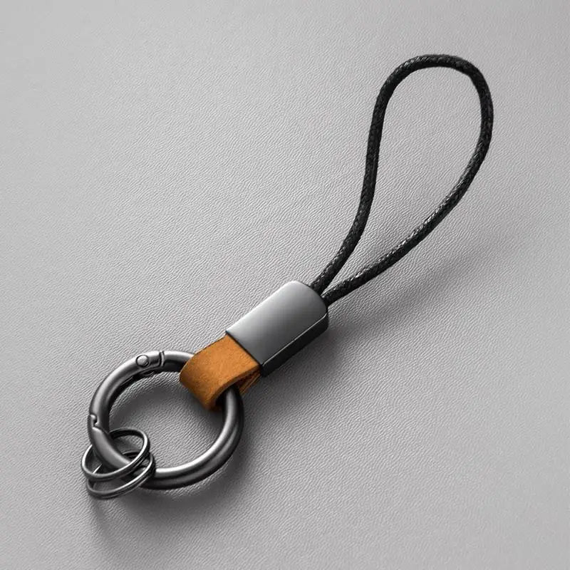 Llaveros de cuero genuino para hombres y mujeres, llavero de coche con cordón de algodón, llavero de metal, regalo, llavero moderno.
