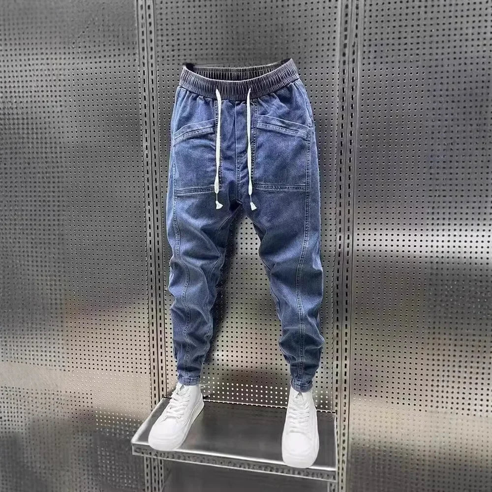 Pantalones vaqueros holgados de talla grande para hombre, informales, de moda, para otoño e invierno, con puños, estilo coreano, versátiles, duraderos, cómodos y ajustados.