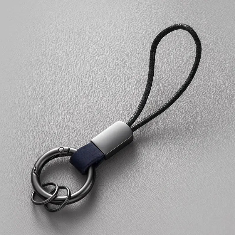 Llaveros de cuero genuino para hombres y mujeres, llavero de coche con cordón de algodón, llavero de metal, regalo, llavero moderno.