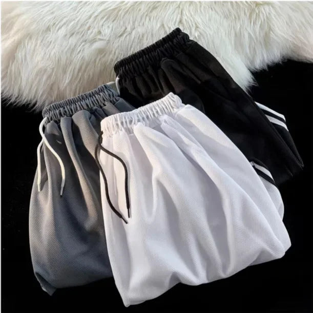 Pantalones cortos de baloncesto holgados para hombre, para correr, playa, verano, estilo americano, deportivos, informales, versátiles, de cinco pulgadas de largo.