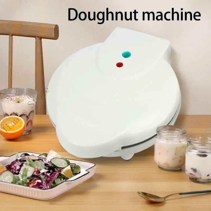 Mini máquina para hacer donas de 1000 W con superficie antiadherente. Prepara 7 donas pequeñas. Ideal para postres infantiles.