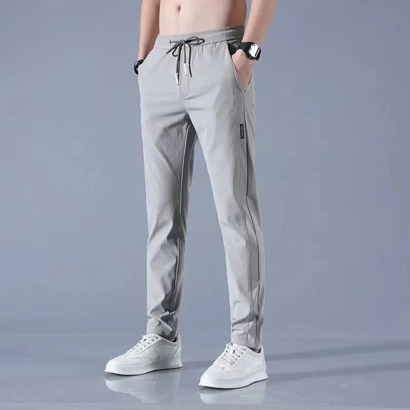 Pantalones deportivos largos de seda de hielo para hombre, de verano, nuevos, finos, informales, de negocios, elásticos, transpirables, de pierna recta, de talla grande