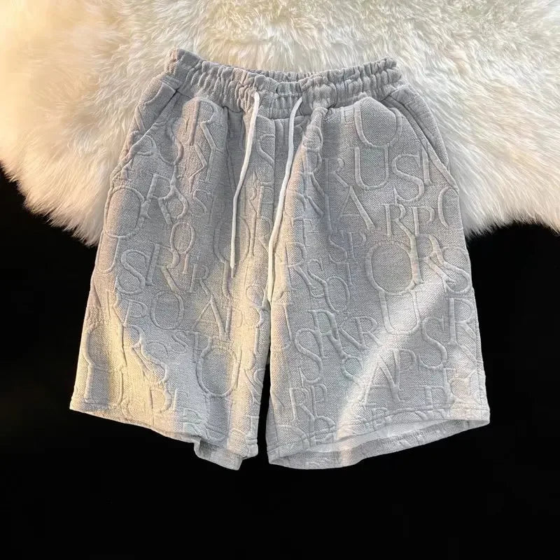 Pantalones cortos holgados de cinco puntos para hombre, estilo americano, estilo retro, de baloncesto, informales, de verano, con diseño de nicho y sensación de ocio.