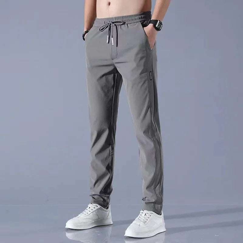 Pantalones deportivos largos de seda de hielo para hombre, de verano, nuevos, finos, informales, de negocios, elásticos, transpirables, de pierna recta, de talla grande