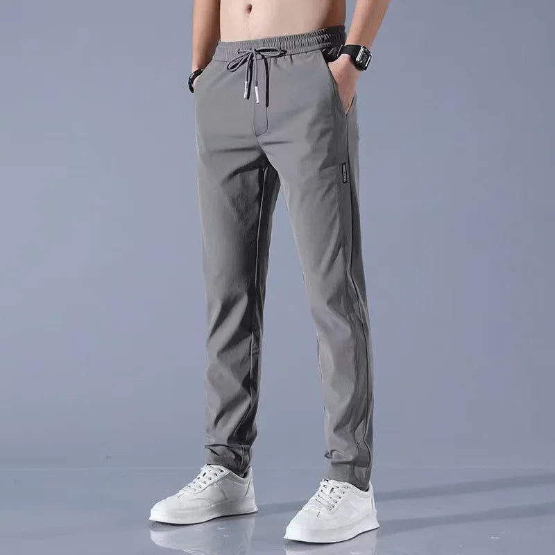 Pantalones deportivos largos de seda de hielo para hombre, de verano, nuevos, finos, informales, de negocios, elásticos, transpirables, de pierna recta, de talla grande