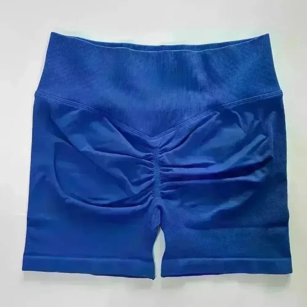 Pantalones cortos deportivos de yoga para mujer, de verano, con efecto piel de melocotón, con bolsillo en la cadera, cintura alta, levantamiento de cadera, secado rápido.