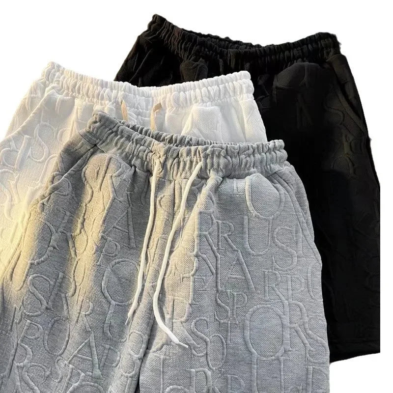 Pantalones cortos holgados de cinco puntos para hombre, estilo americano, estilo retro, de baloncesto, informales, de verano, con diseño de nicho y sensación de ocio.