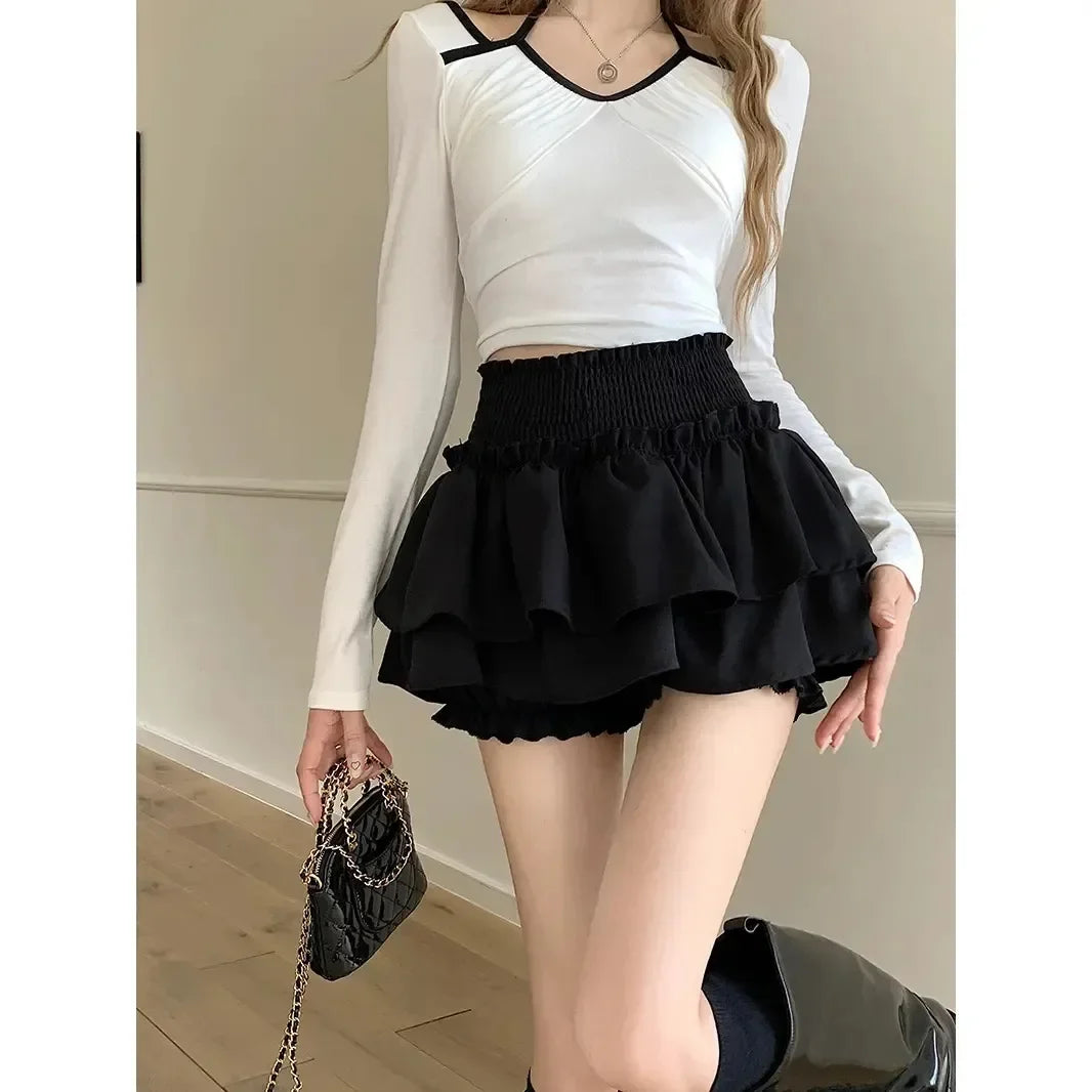 Falda negra con volantes para mujer, cintura alta, adelgazante, corte A, minimalista, estilo ballet, para verano, pantalones cortos antiexposición.