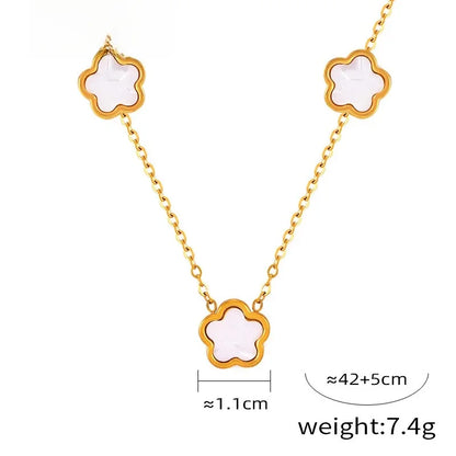 Conjunto de joyería con accesorios rústicos de flores de acero de titanio y concha blanca, pendientes de acrílico y collar sencillo.