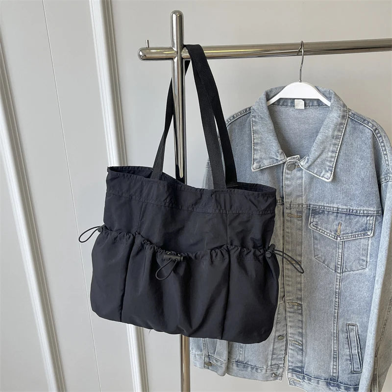 1 bolso de mano de gran capacidad, moderno, de lona, para el hombro, para el trabajo y los desplazamientos.