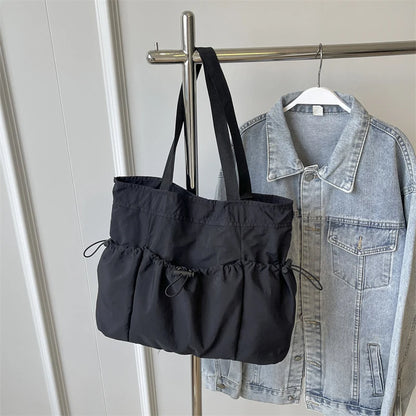 1 bolso de mano de gran capacidad, moderno, de lona, para el hombro, para el trabajo y los desplazamientos.