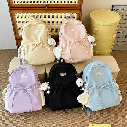 Bonita mochila escolar de nailon con doble hombro para niña, capacidad de 20 a 35 litros, forro de polietileno, correa curva, diseño de color liso.