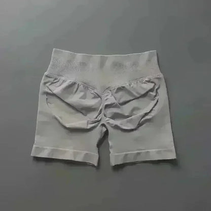 Pantalones cortos deportivos de yoga para mujer, de verano, con efecto piel de melocotón, con bolsillo en la cadera, cintura alta, levantamiento de cadera, secado rápido.