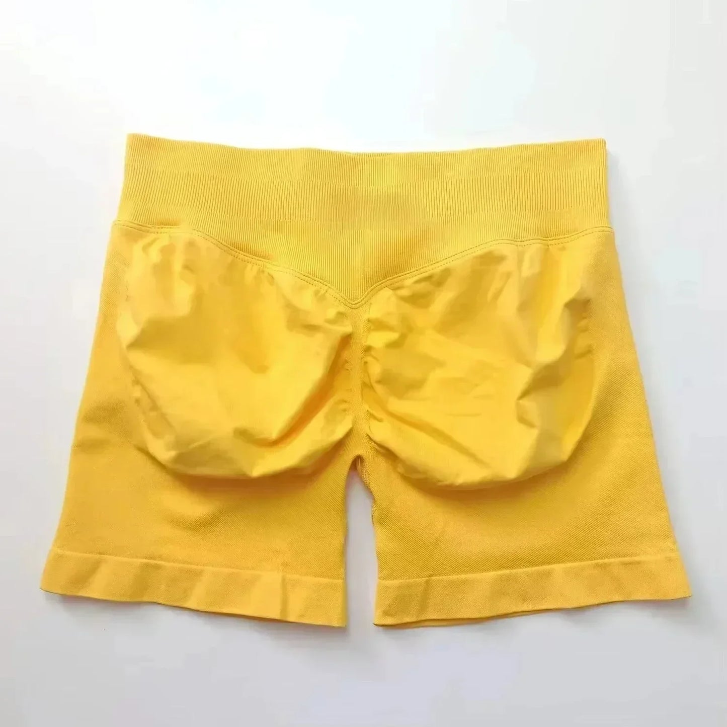 Pantalones cortos deportivos de yoga para mujer, de verano, con efecto piel de melocotón, con bolsillo en la cadera, cintura alta, levantamiento de cadera, secado rápido.
