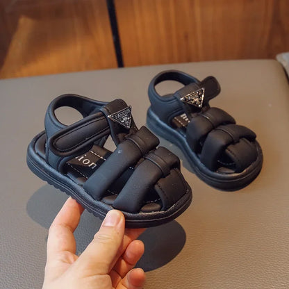Sandalias para niños, novedad de verano 2024, moda para niños y niñas, color sólido, con cierre de velcro, antideslizantes, suela suave, decoración metálica versátil.