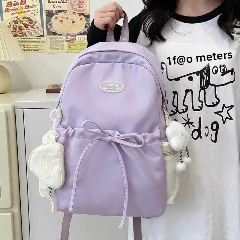 Bonita mochila escolar de nailon con doble hombro para niña, capacidad de 20 a 35 litros, forro de polietileno, correa curva, diseño de color liso.