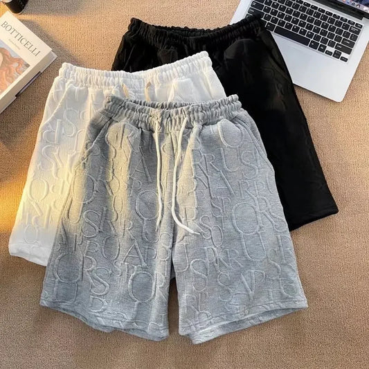 Pantalones cortos holgados de cinco puntos para hombre, estilo americano, estilo retro, de baloncesto, informales, de verano, con diseño de nicho y sensación de ocio.