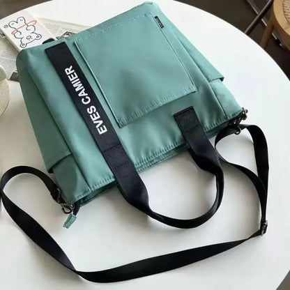 Nuevo bolso de hombro informal de gran capacidad, de nailon, impermeable, de lona, sencillo y moderno, para colegiala.
