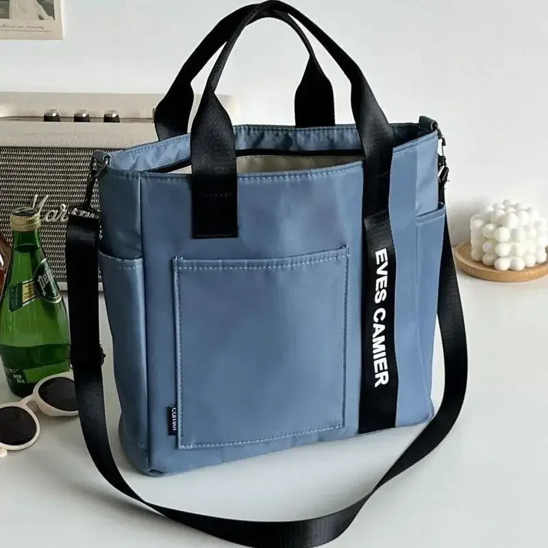 Nuevo bolso de hombro informal de gran capacidad, de nailon, impermeable, de lona, sencillo y moderno, para colegiala.