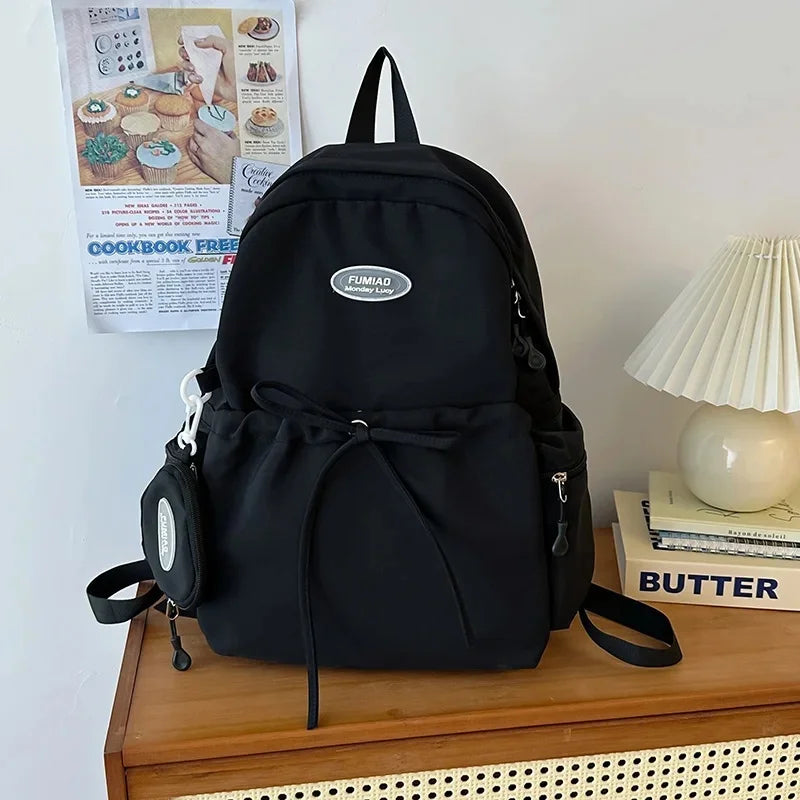 Bonita mochila escolar de nailon con doble hombro para niña, capacidad de 20 a 35 litros, forro de polietileno, correa curva, diseño de color liso.