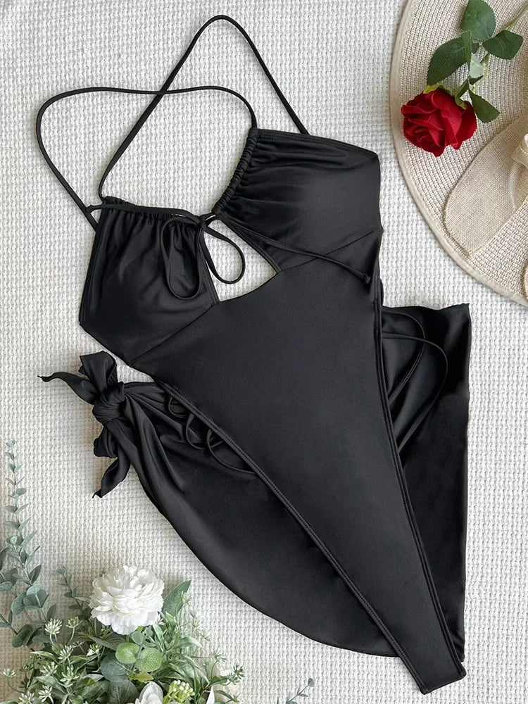 Traje de baño de una pieza tipo tanga, con espalda descubierta y diseño ultra mini, estilo tanga, para mujer. Incluye pareo, corte alto y diseño monokini.