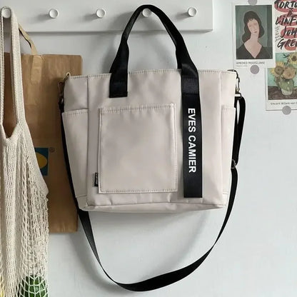 Nuevo bolso de hombro informal de gran capacidad, de nailon, impermeable, de lona, sencillo y moderno, para colegiala.