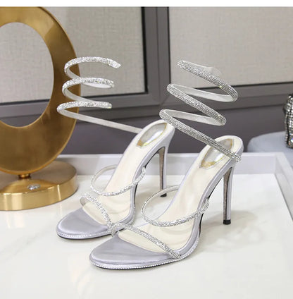 Sandalias de verano de moda para mujer, con diseño de serpiente y cristales, adornadas con lujosos diamantes de imitación y tacones finos estilo gladiador. Ideales para fiestas y eventos.