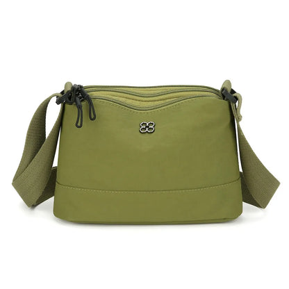 Bolso de hombro de nailon suave y moderno para mujer, de color liso, estilo informal, con múltiples bolsillos, bolso de mano para estudiante.