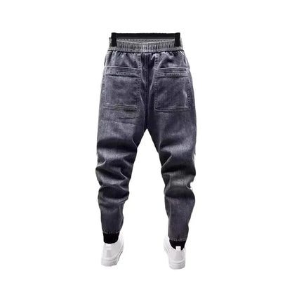Pantalones vaqueros holgados de talla grande para hombre, informales, de moda, para otoño e invierno, con puños, estilo coreano, versátiles, duraderos, cómodos y ajustados.