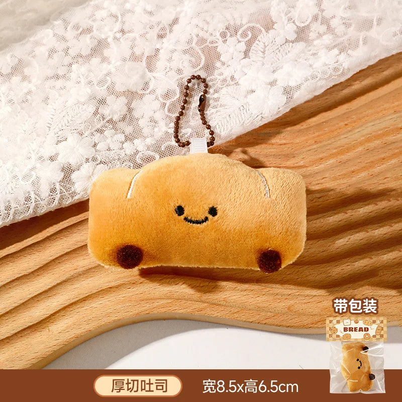 Panes lindos, bolsas de peluche, colgantes, llaveros, accesorios creativos para muñecas pequeñas, mochilas de dibujos animados para niñas al por mayor.
