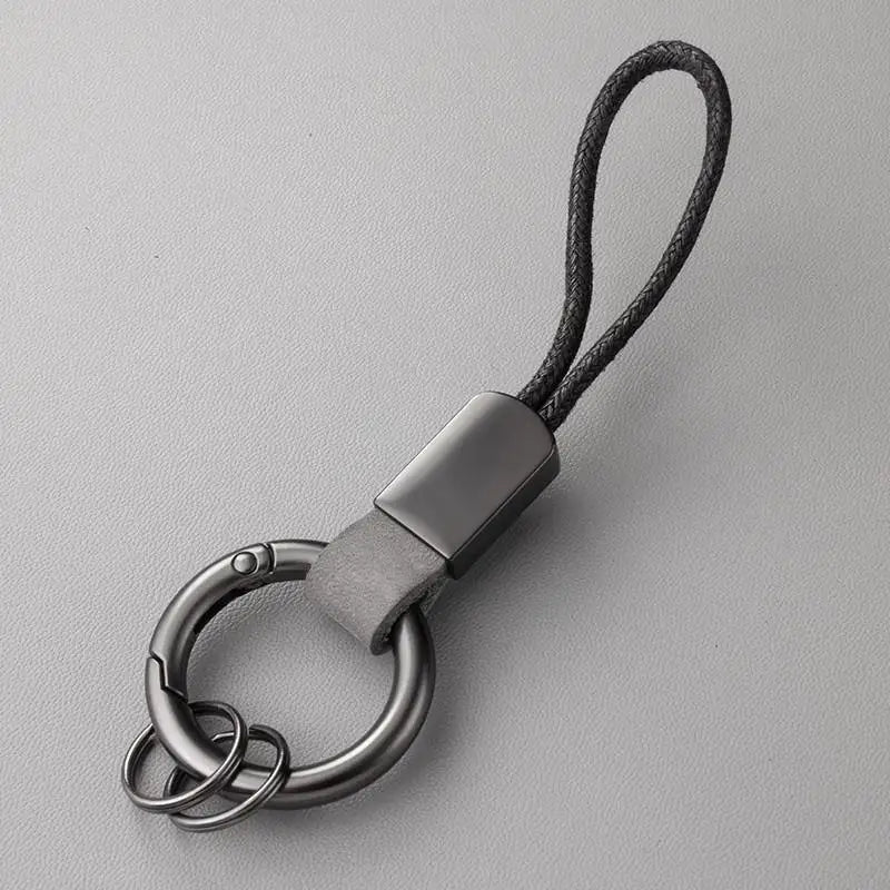 Llaveros de cuero genuino para hombres y mujeres, llavero de coche con cordón de algodón, llavero de metal, regalo, llavero moderno.