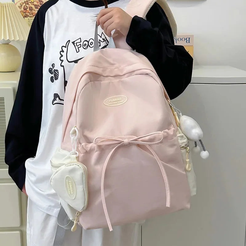 Bonita mochila escolar de nailon con doble hombro para niña, capacidad de 20 a 35 litros, forro de polietileno, correa curva, diseño de color liso.