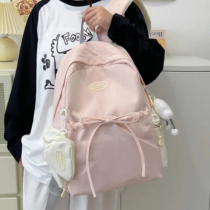 Bonita mochila escolar de nailon con doble hombro para niña, capacidad de 20 a 35 litros, forro de polietileno, correa curva, diseño de color liso.