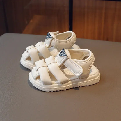 Sandalias para niños, novedad de verano 2024, moda para niños y niñas, color sólido, con cierre de velcro, antideslizantes, suela suave, decoración metálica versátil.