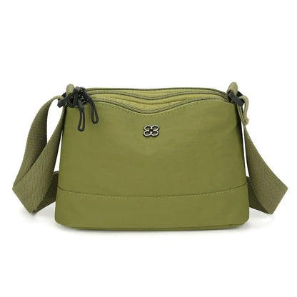 Bolso de hombro de nailon suave y moderno para mujer, de color liso, estilo informal, con múltiples bolsillos, bolso de mano para estudiante.