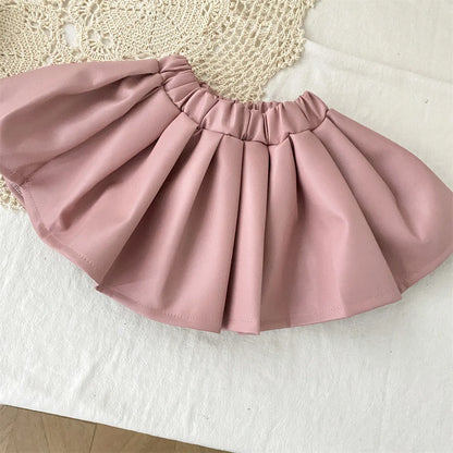 Conjunto de ropa infantil 2025, otoño, nueva y genial chaqueta de cuero sintético para niñas con falda corta, conjunto de dos piezas a la moda.