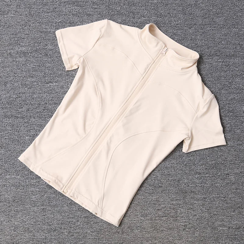 Camisetas de entrenamiento adelgazantes de cintura de verano de alta calidad para mujer, de secado rápido, con cuello alto ajustado y cremallera completa, camisetas de yoga de manga corta.