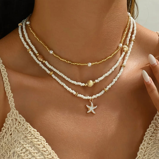 Gargantilla bohemia hecha a mano con cuentas apiladas, delicado collar con colgante de concha de estrella de mar, joyería para mujer para fiestas de playa y vacaciones de verano