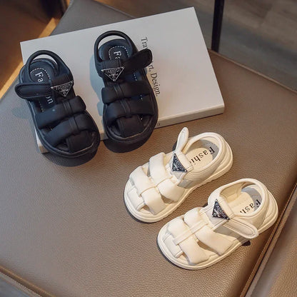 Sandalias para niños, novedad de verano 2024, moda para niños y niñas, color sólido, con cierre de velcro, antideslizantes, suela suave, decoración metálica versátil.