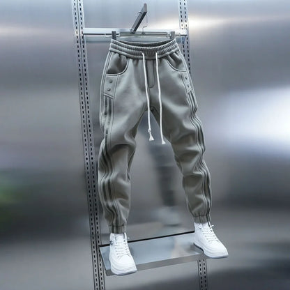 Pantalones casuales de primavera 2025 para hombre, modernos, con cintura elástica y banda, pantalones deportivos versátiles y de moda.