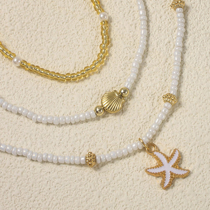 Gargantilla bohemia hecha a mano con cuentas apiladas, delicado collar con colgante de concha de estrella de mar, joyería para mujer para fiestas de playa y vacaciones de verano