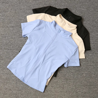 Camisetas de entrenamiento adelgazantes de cintura de verano de alta calidad para mujer, de secado rápido, con cuello alto ajustado y cremallera completa, camisetas de yoga de manga corta.