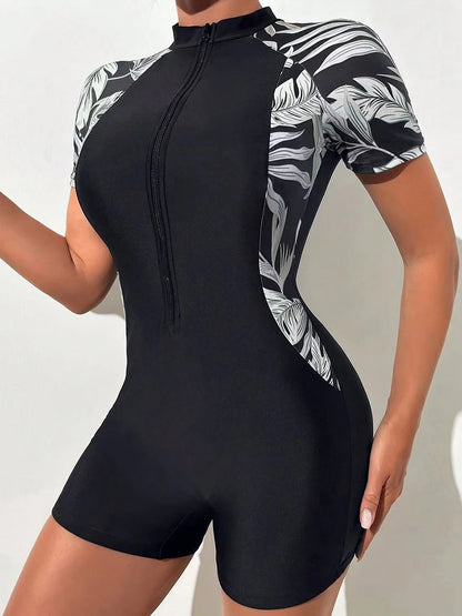 Traje de baño enterizo floral para mujer, manga corta, cierre frontal, estampado tropical, ideal para surfear, con protección solar (sin sujetador incorporado).